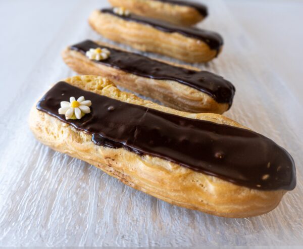 Chocolate and vanilla éclairs made by Le Petit Paris